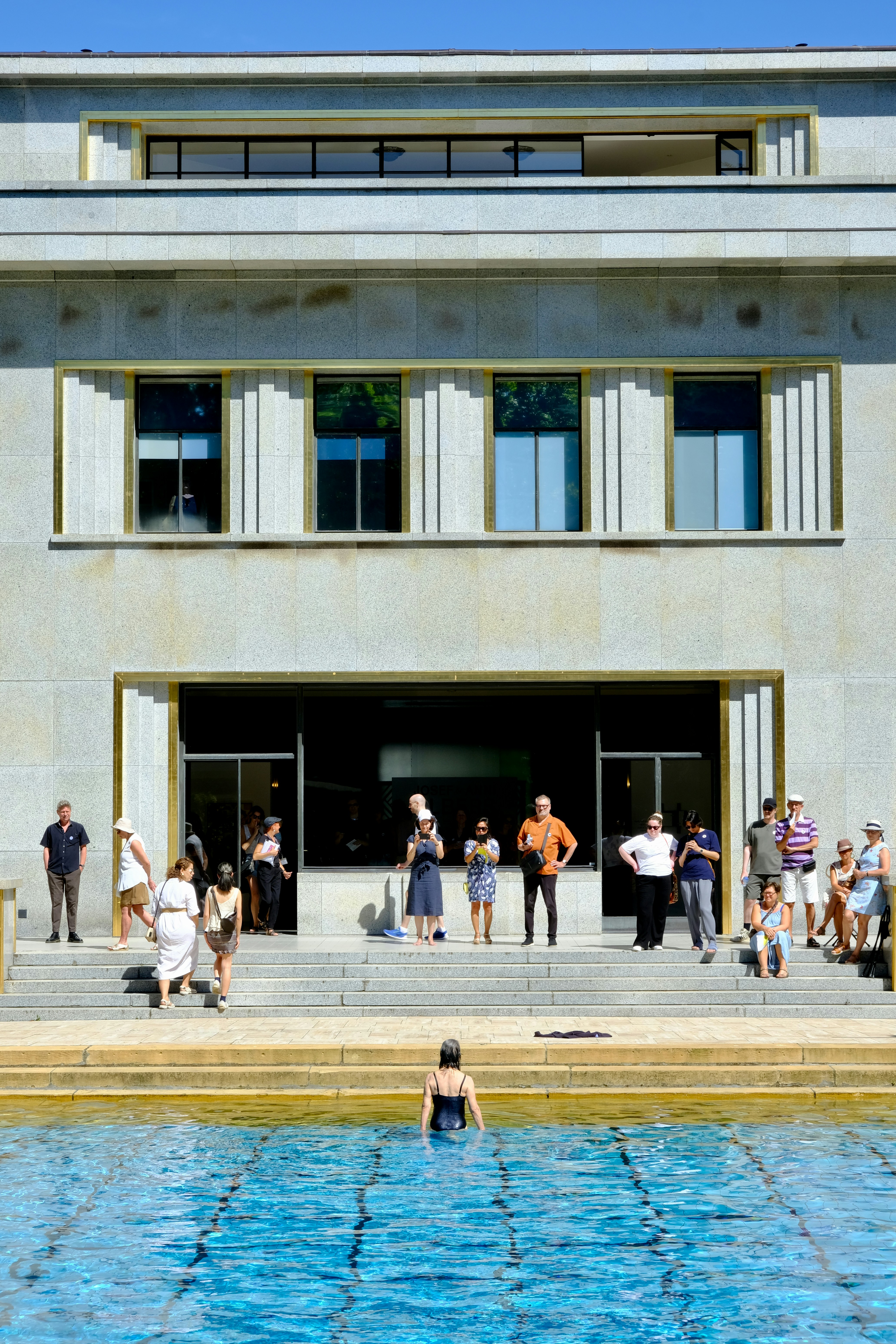 A group of people standing in front of a building