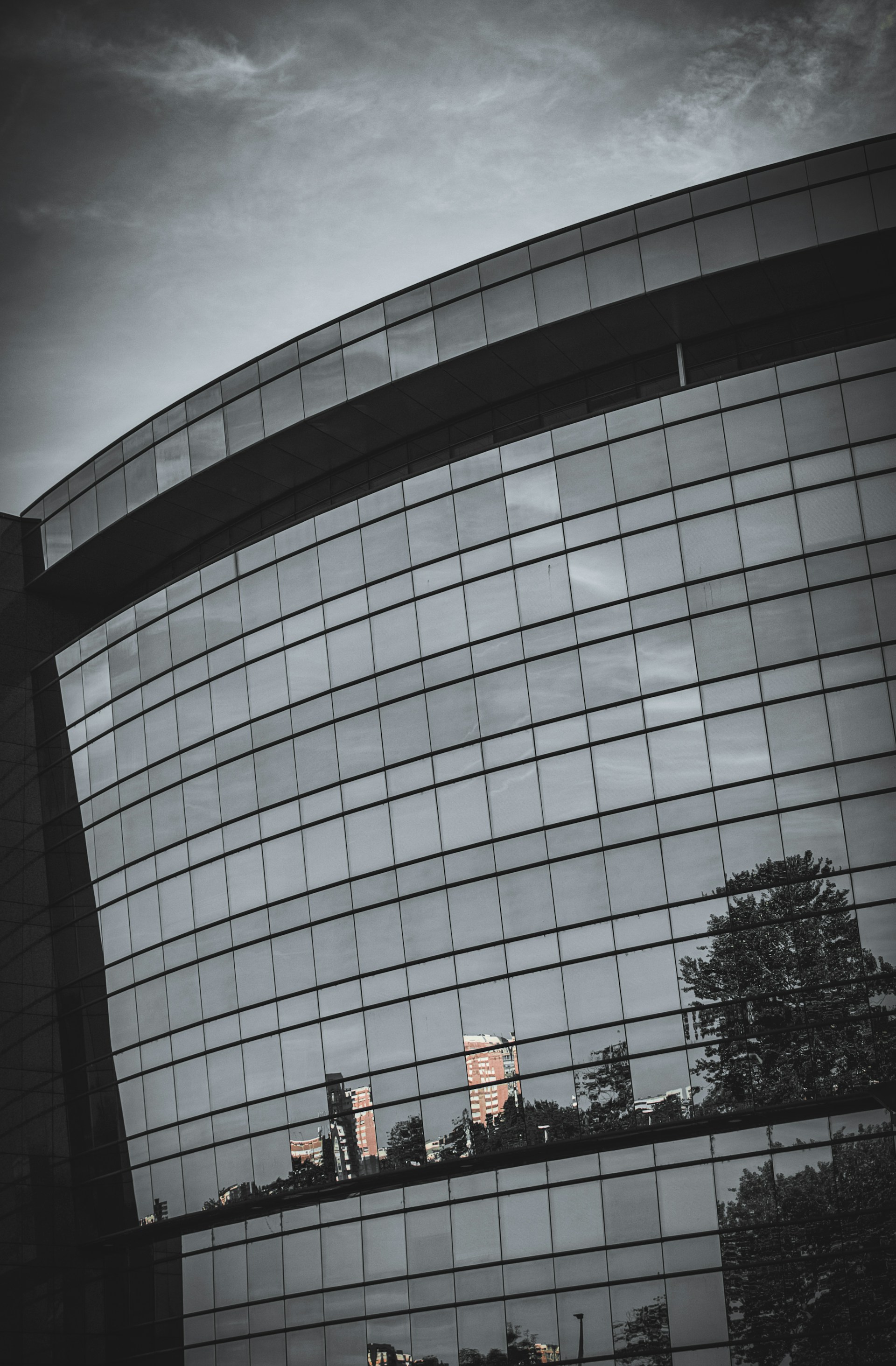 The reflection of a building in the windows of another building