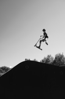 A man flying through the air while riding a skateboard