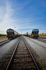 A couple of trains that are sitting on the tracks