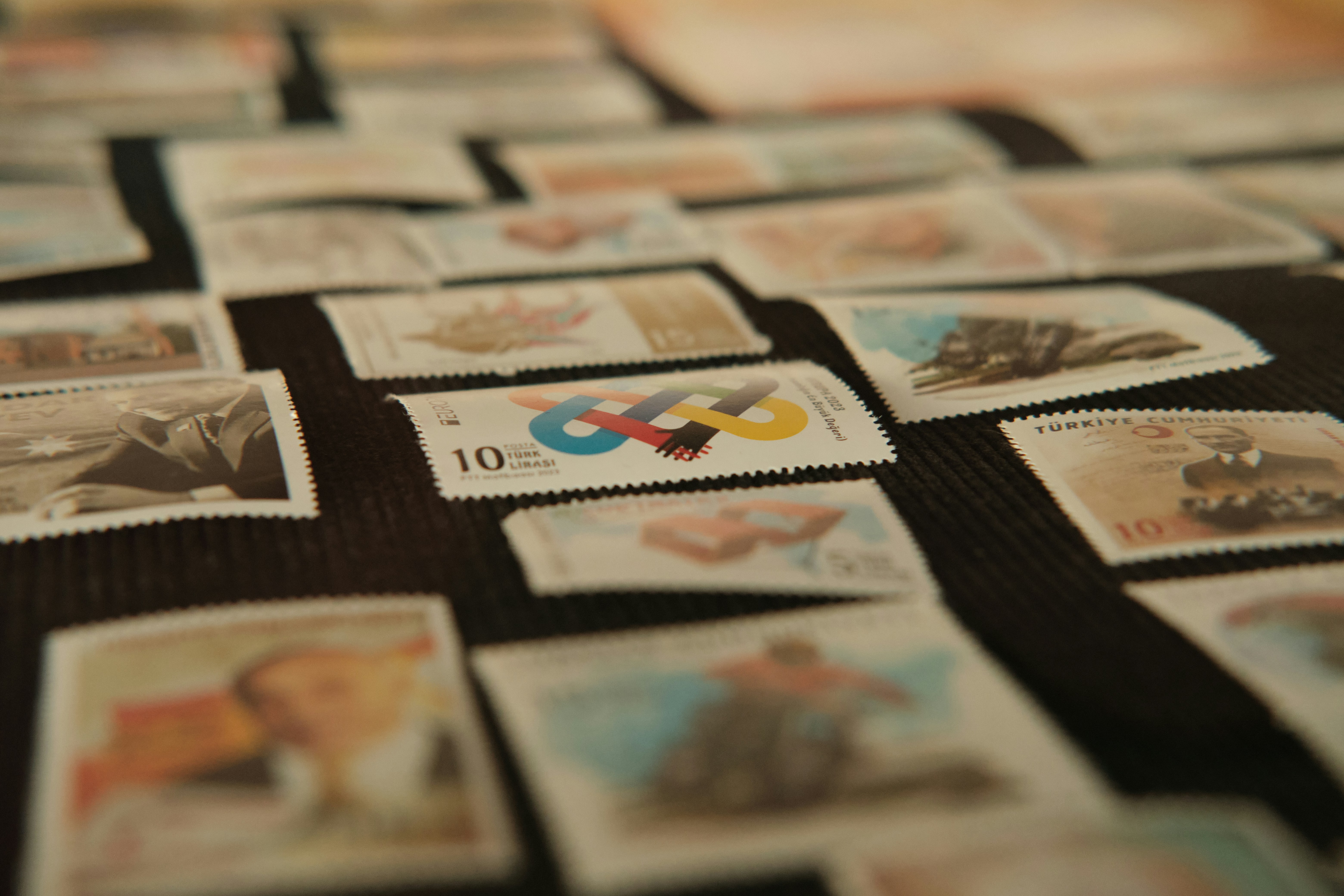 A table covered with lots of postage stamps