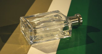 A glass bottle sitting on top of a table