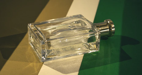 A glass bottle sitting on top of a table