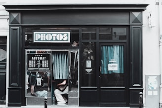 A black and white photo of a store front