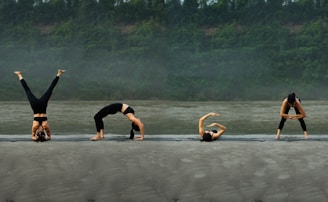 A group of people doing yoga on the beach