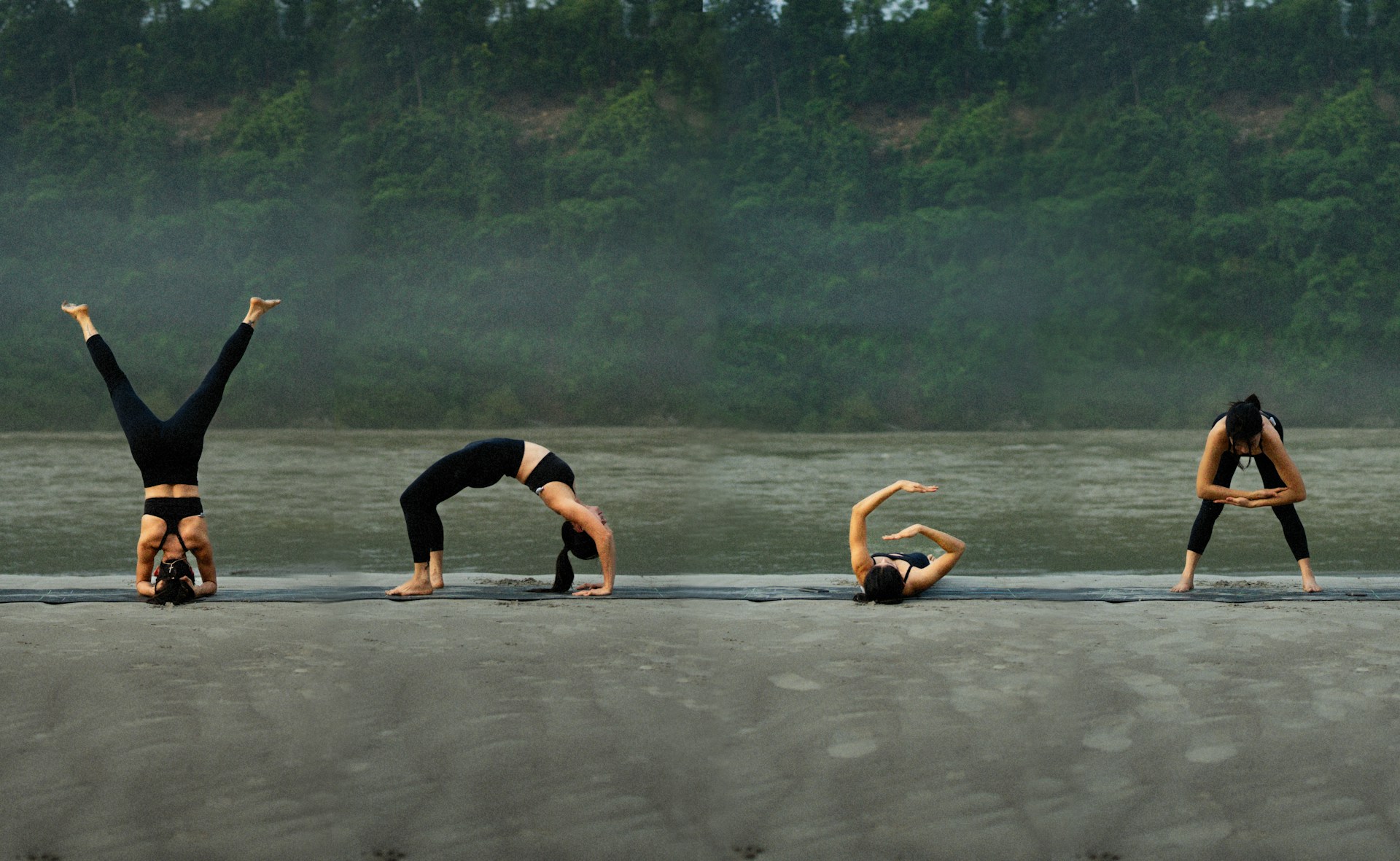A group of people doing yoga on the beach