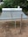 A solar water heater sitting on top of a field