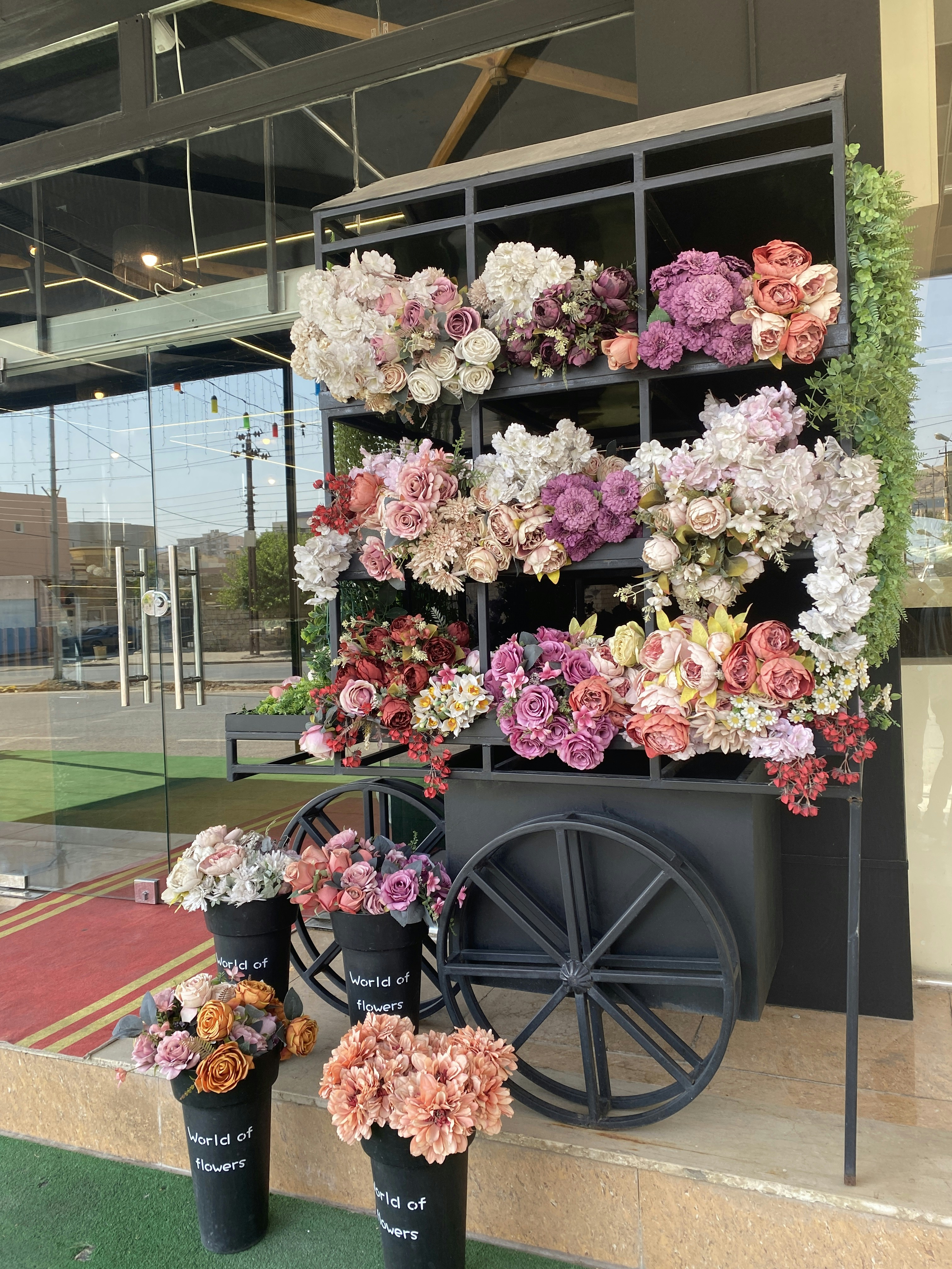 A bunch of flowers that are on a shelf