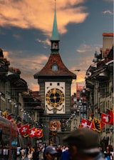 A large clock tower towering over a city street