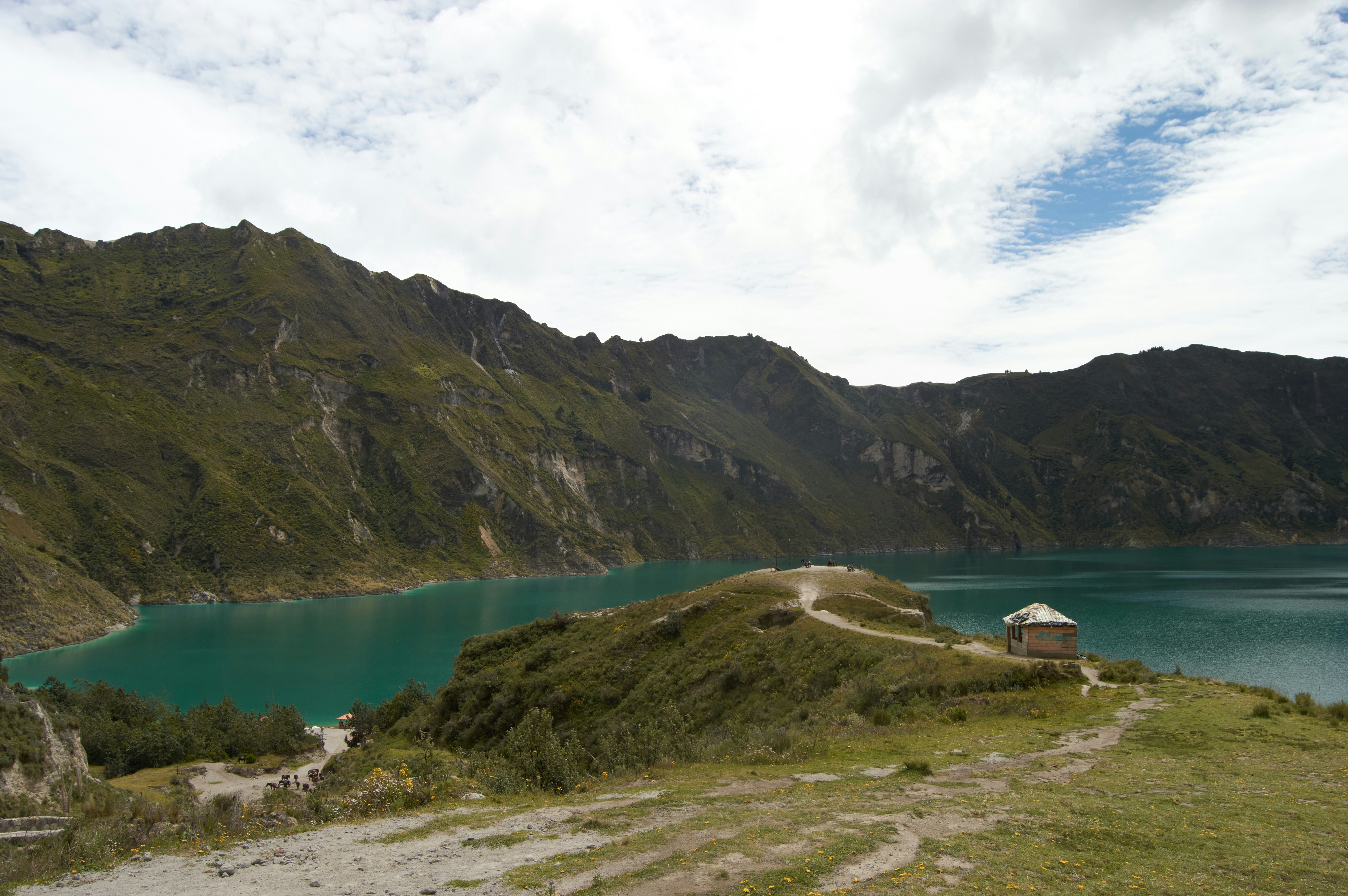 A scenic view of a lake surrounded by mountains