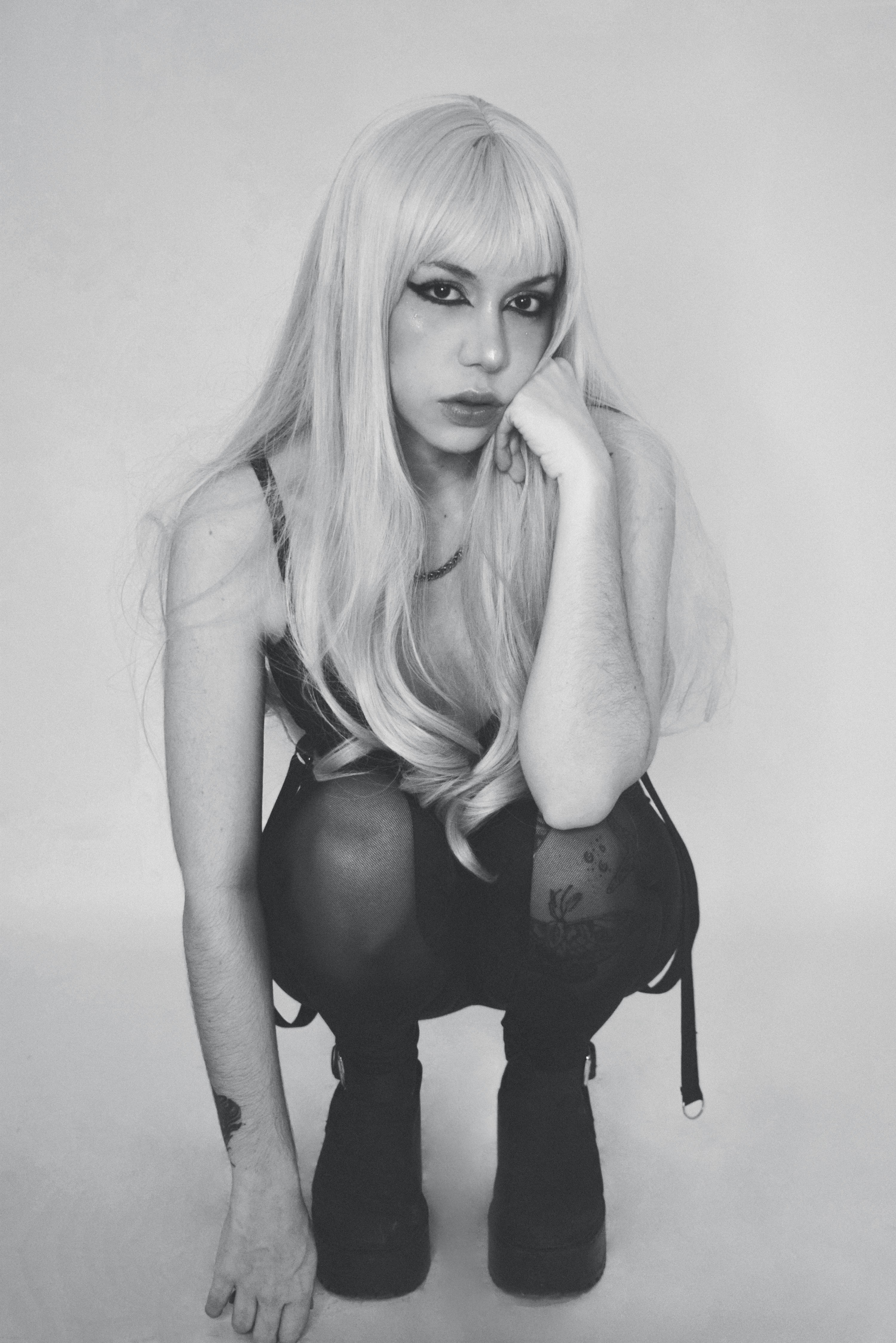 A black and white photo of a woman with long blonde hair