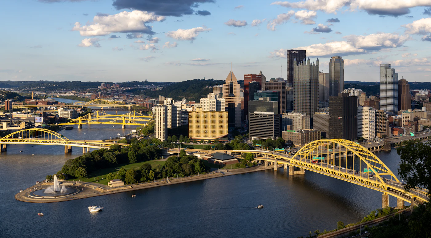 A city skyline and a bridge over a river