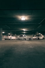 A group of cars parked in a parking garage