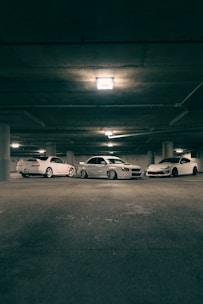 A group of cars parked in a parking garage