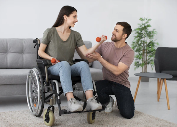 A man in a wheel chair being pushed by a woman