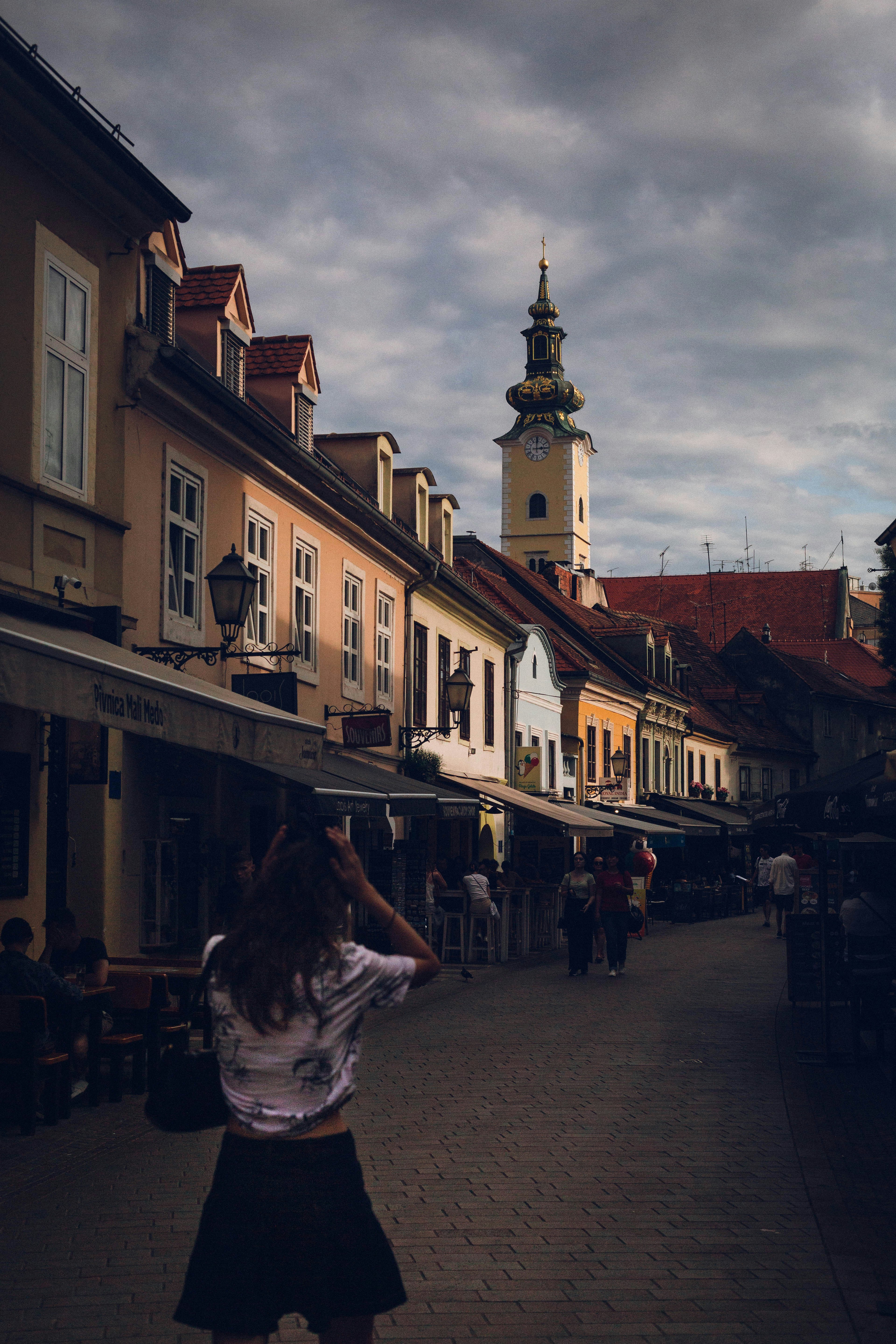 A woman standing in the middle of a street