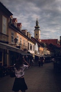 A woman standing in the middle of a street