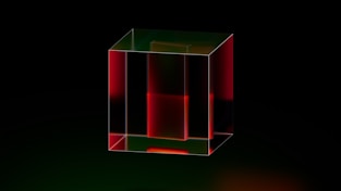 A red and green cube on a black background