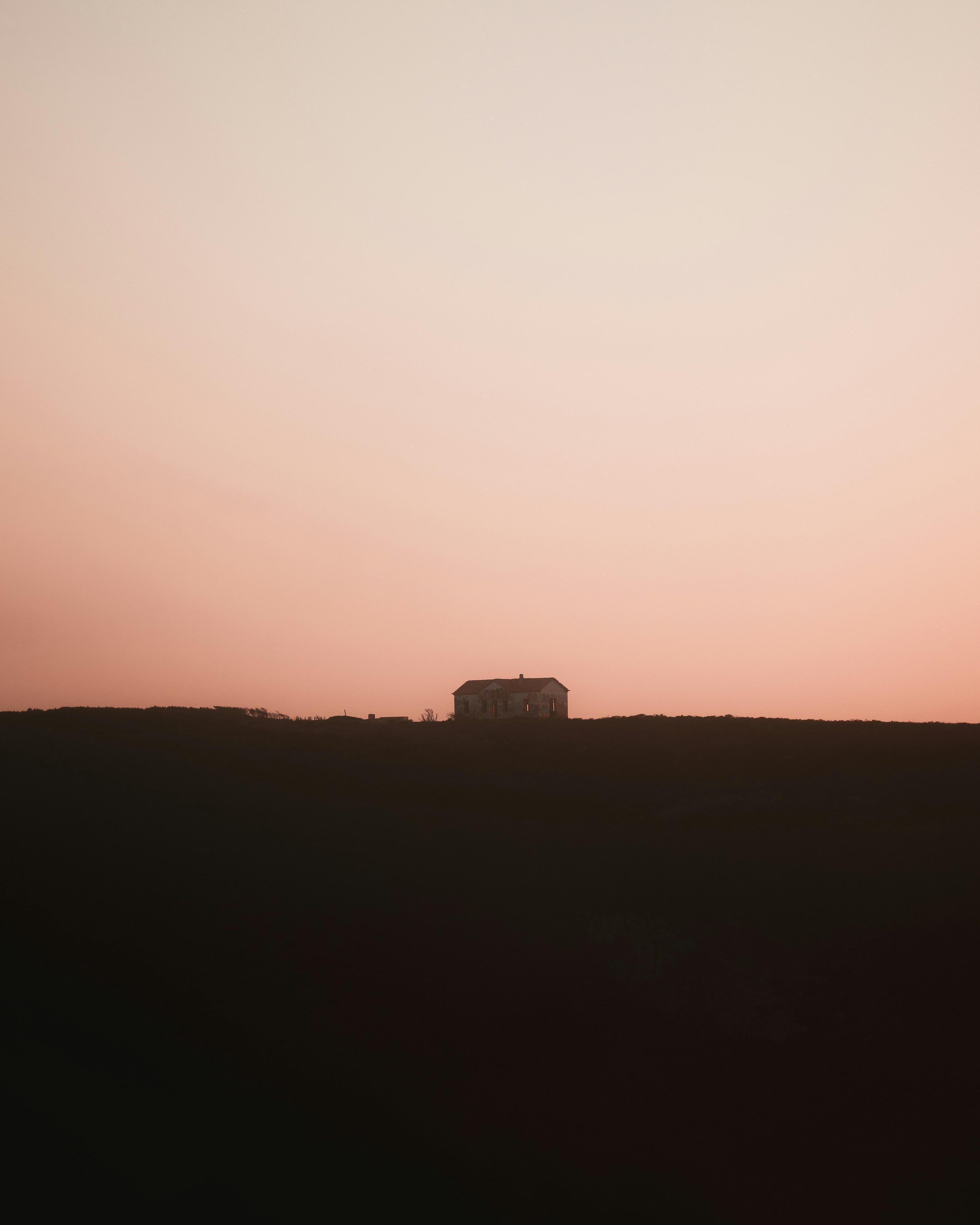 A truck driving down a road at sunset