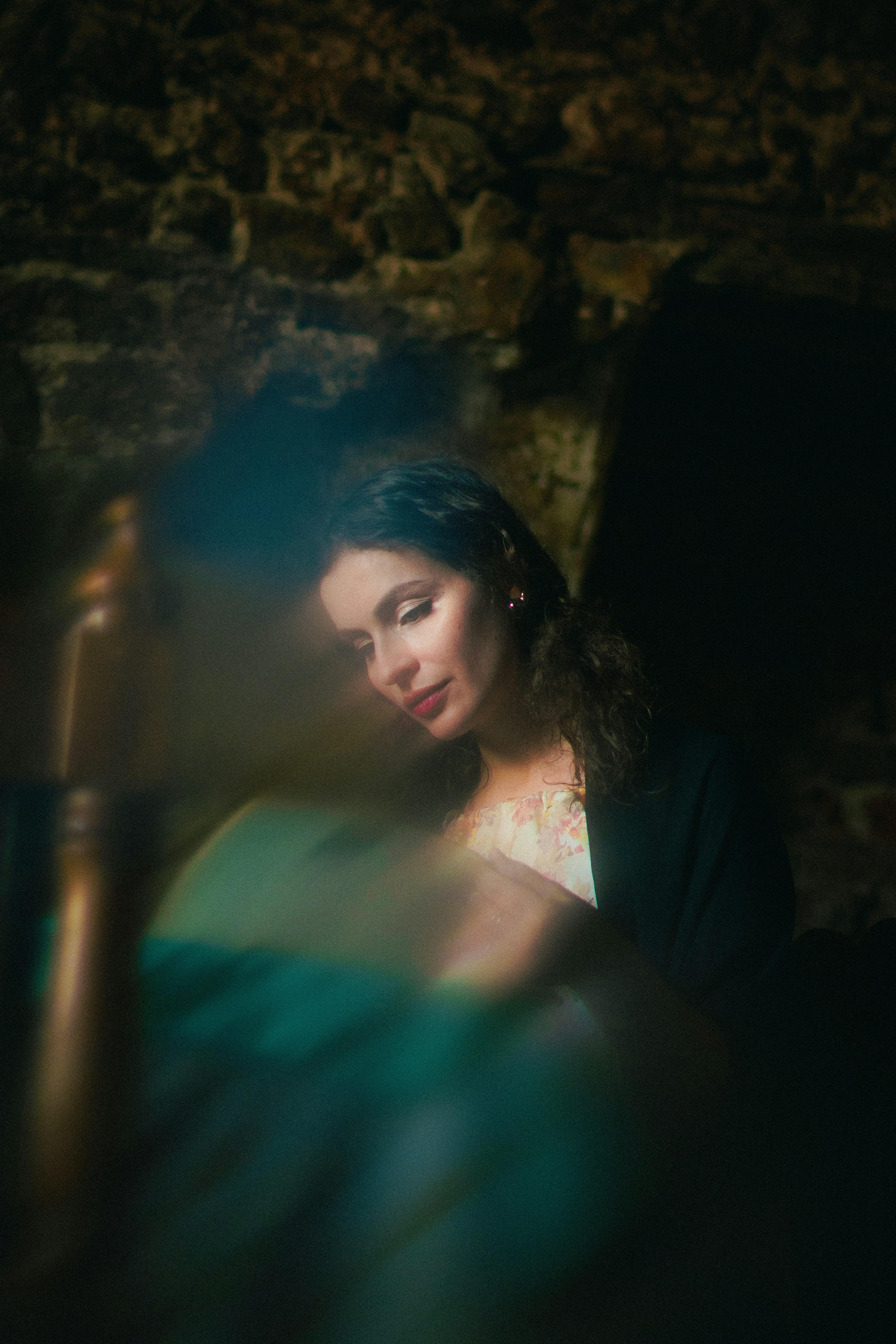 A woman sitting in a chair in a dark room