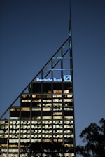 A very tall building lit up at night