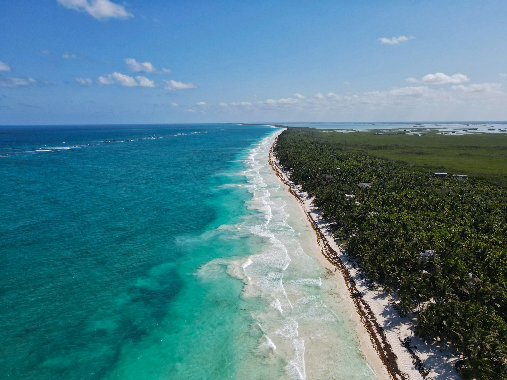 An aerial view of a beach and the ocean