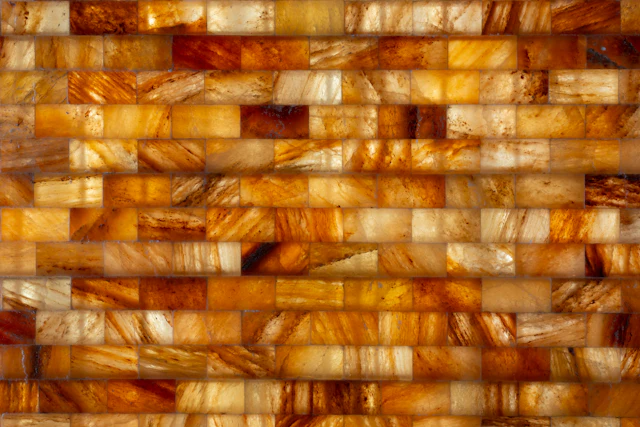 Wall of backlit honey onyx blocks glowing amber and white