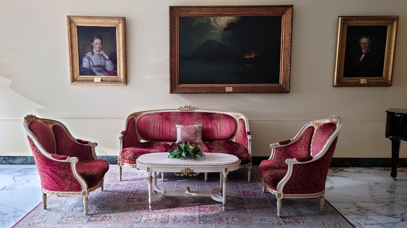 A living room filled with furniture and paintings