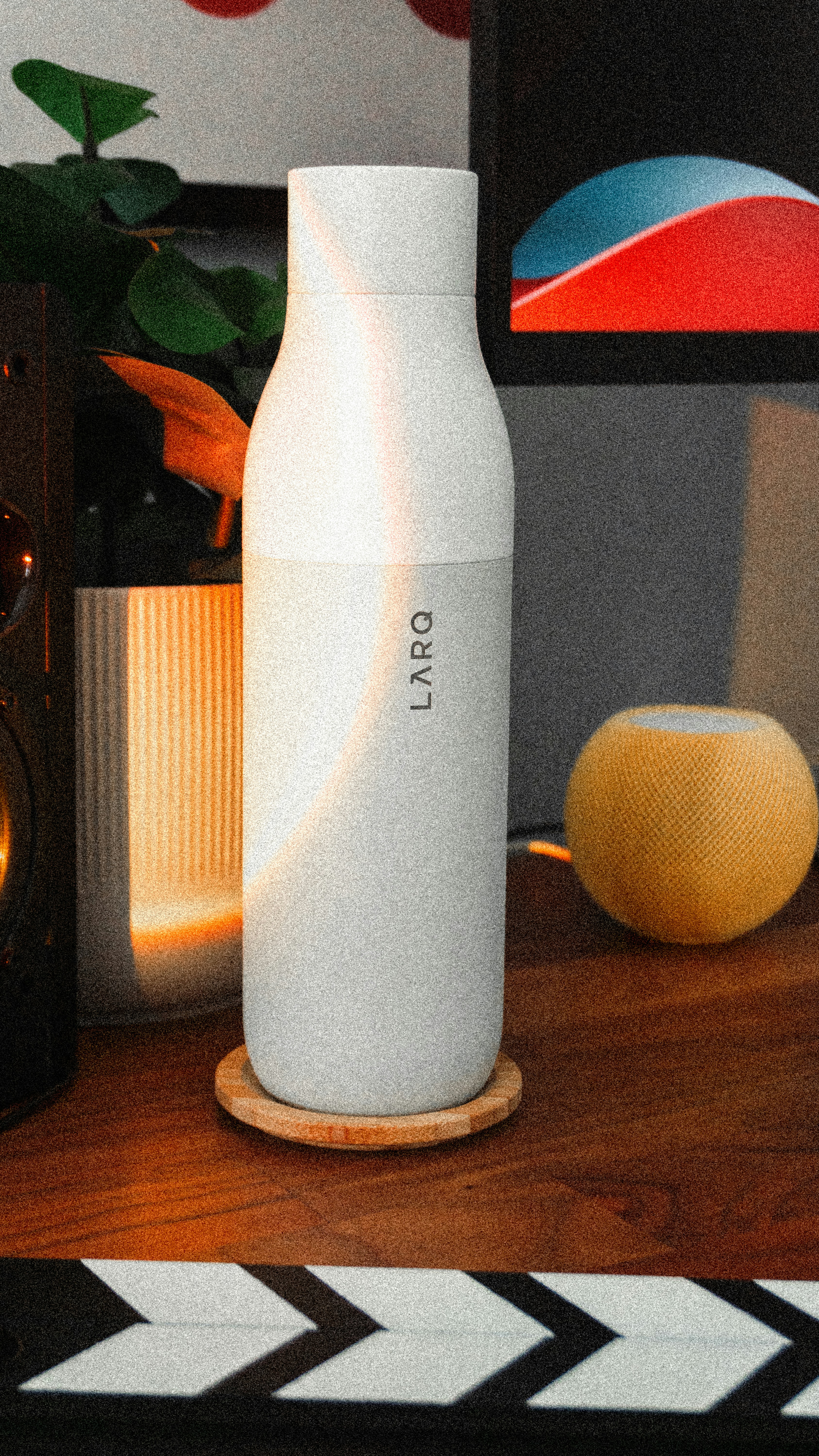 A white bottle sitting on top of a wooden table photo – Free Setup ...