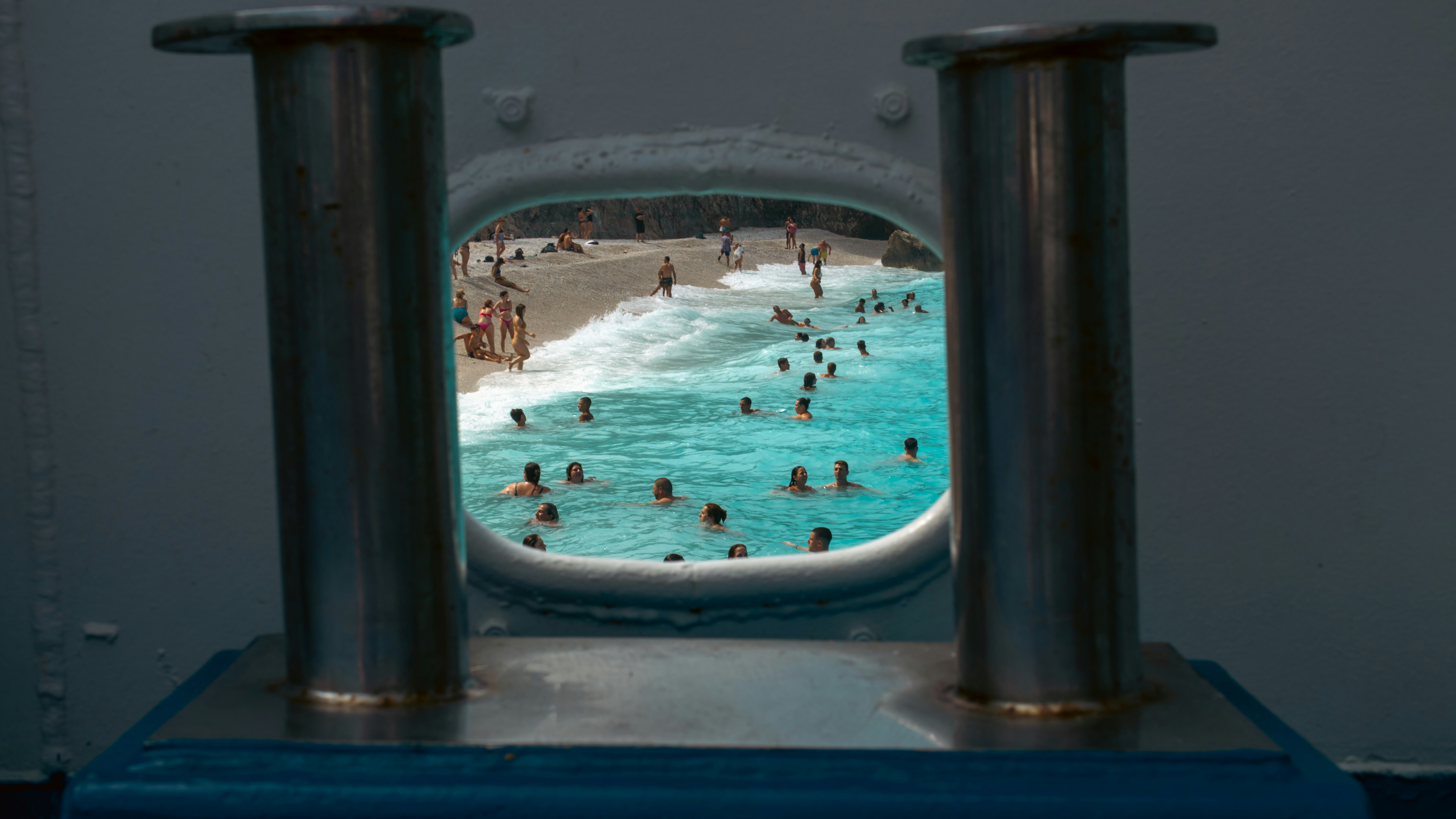 A group of people swimming in a pool of water