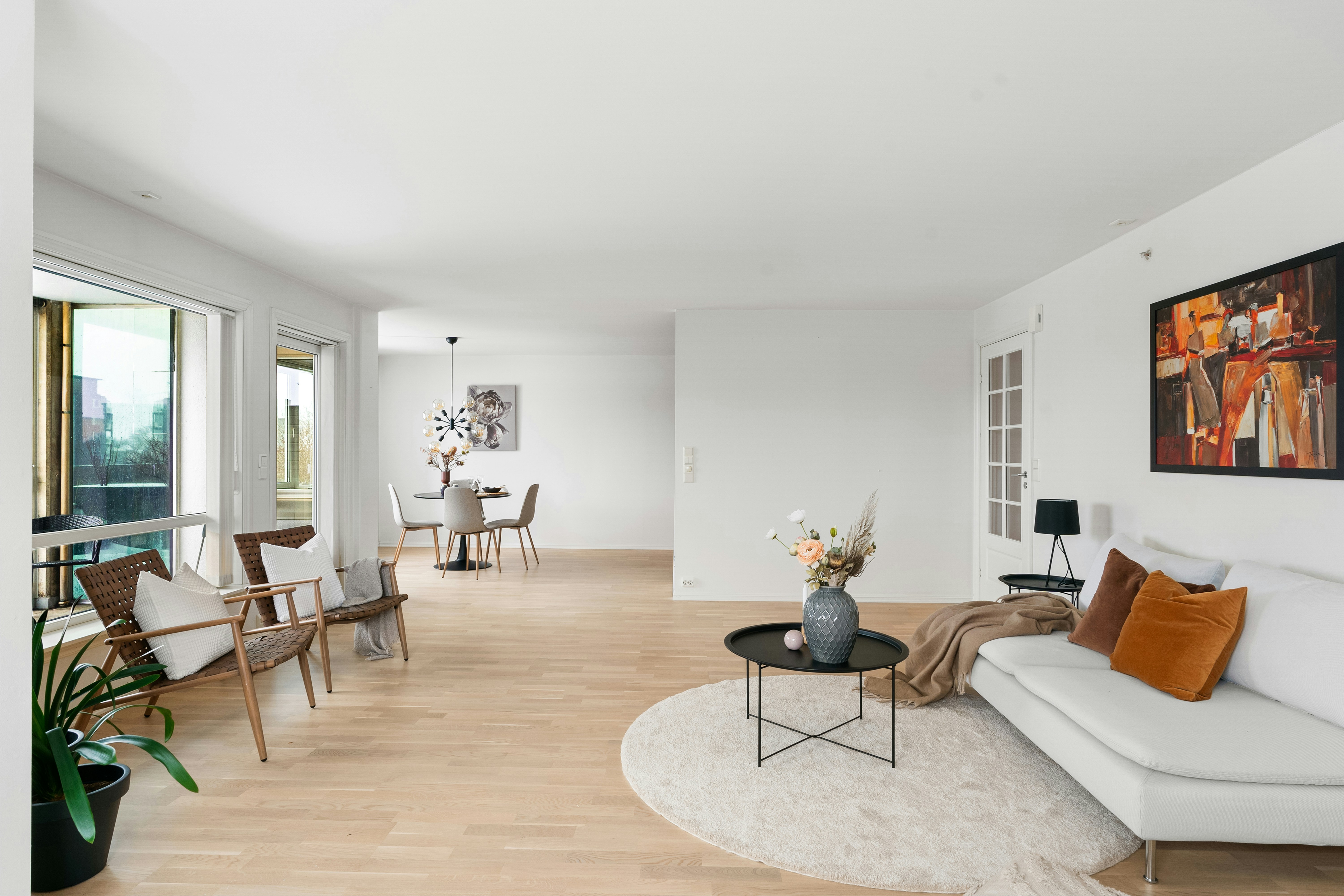 open-plan loft showing clear zoning with furniture and rugs - industrial style apartment