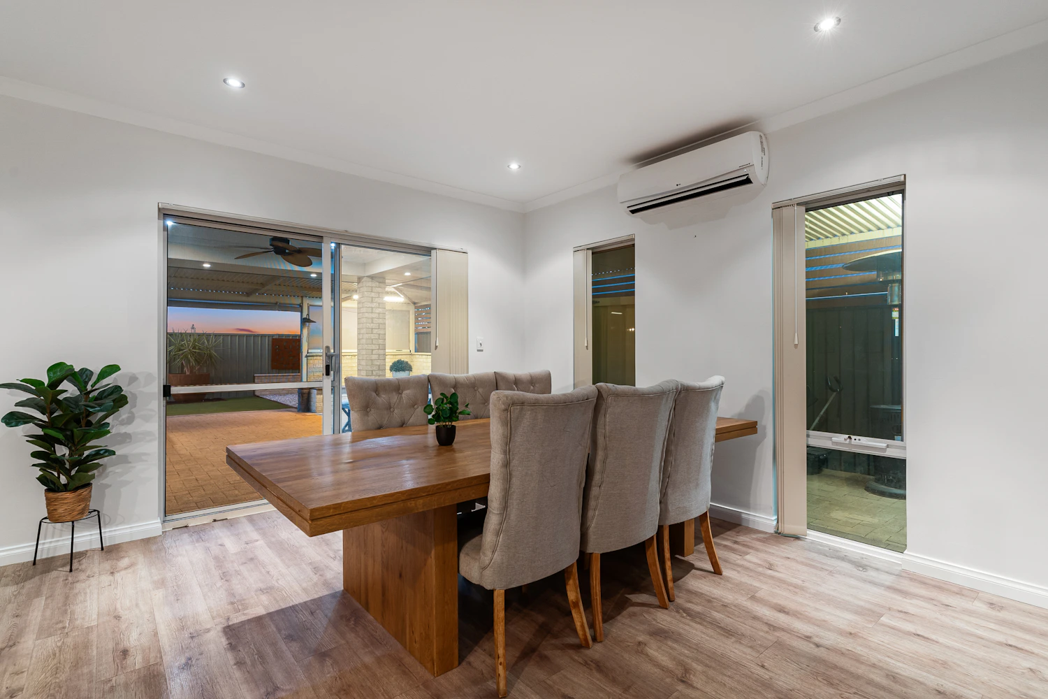 Wood dining table and chairs in a natural interior