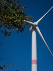 A wind turbine with a blue sky in the background