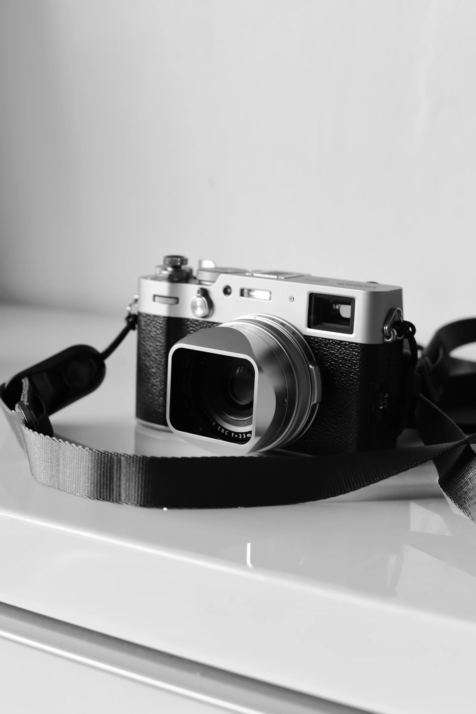 Silver Fujifilm X100 with strap