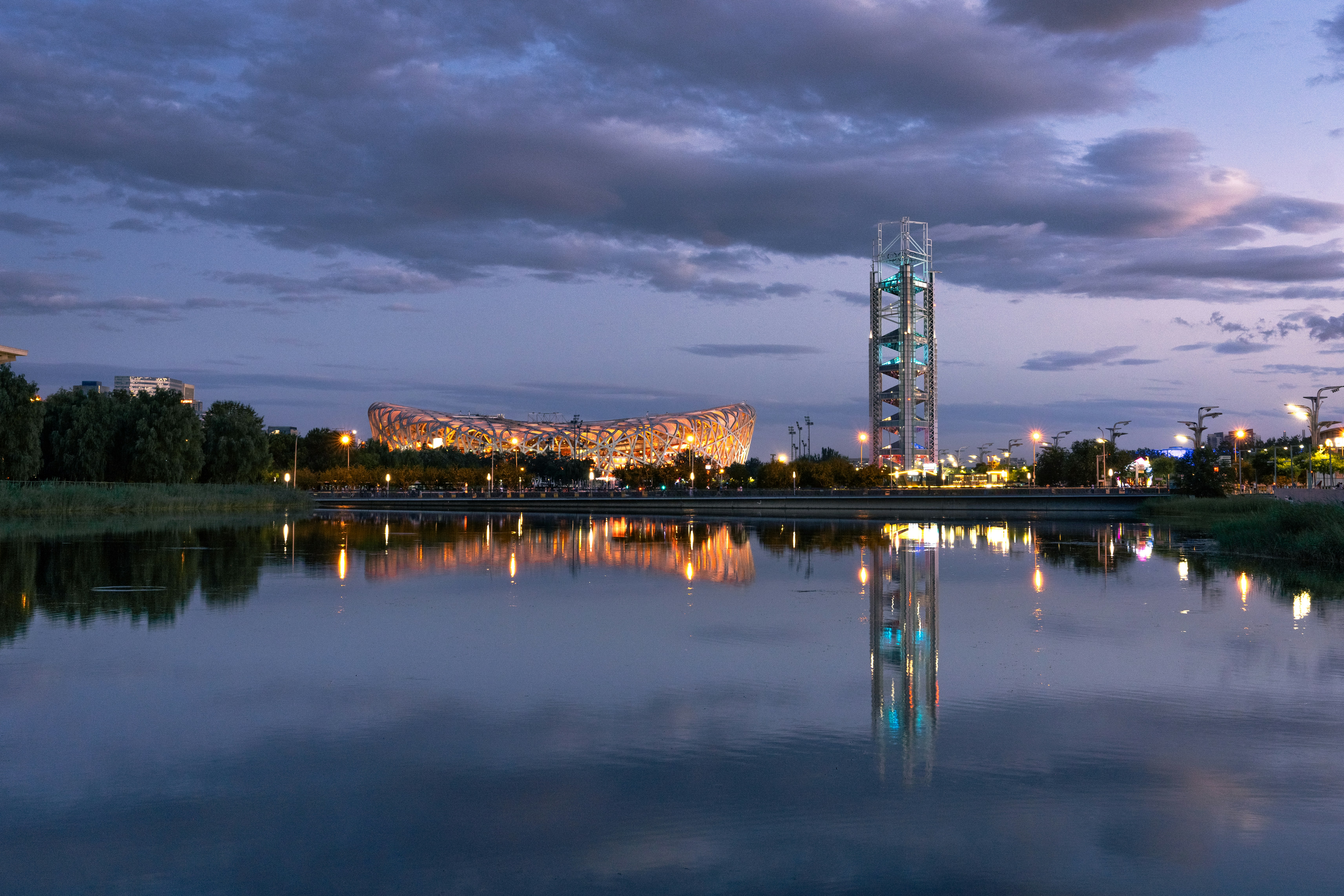 A large body of water with a tower in the background