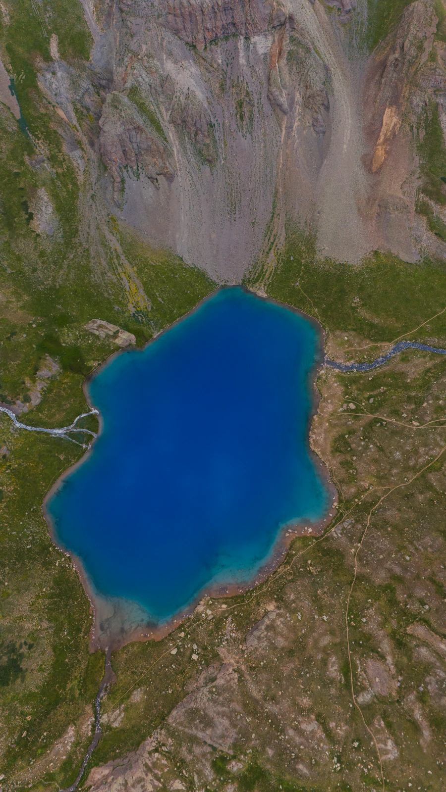 Alpine lake surrounded by mountains