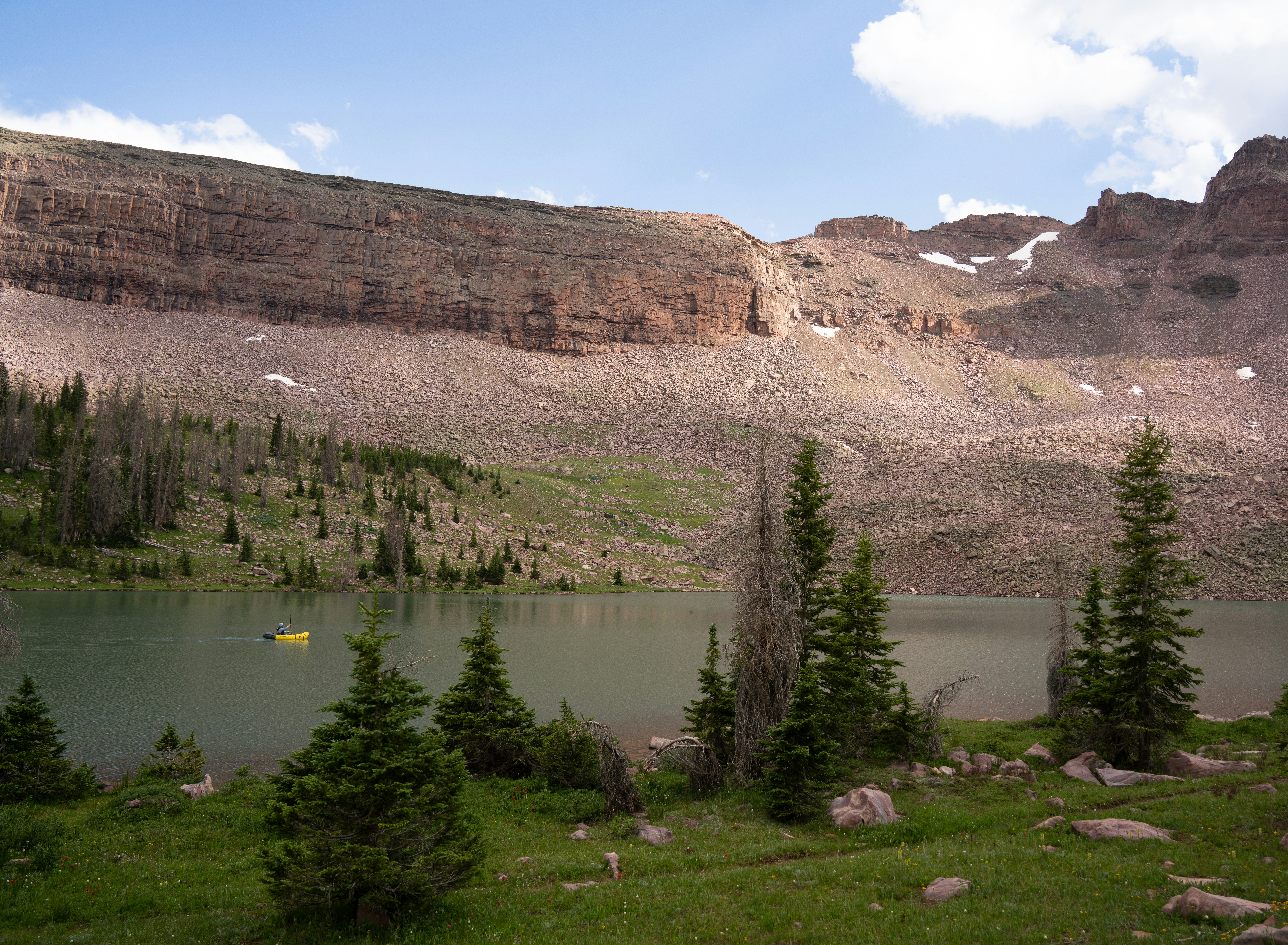 A mountain lake surrounded by trees and rocks