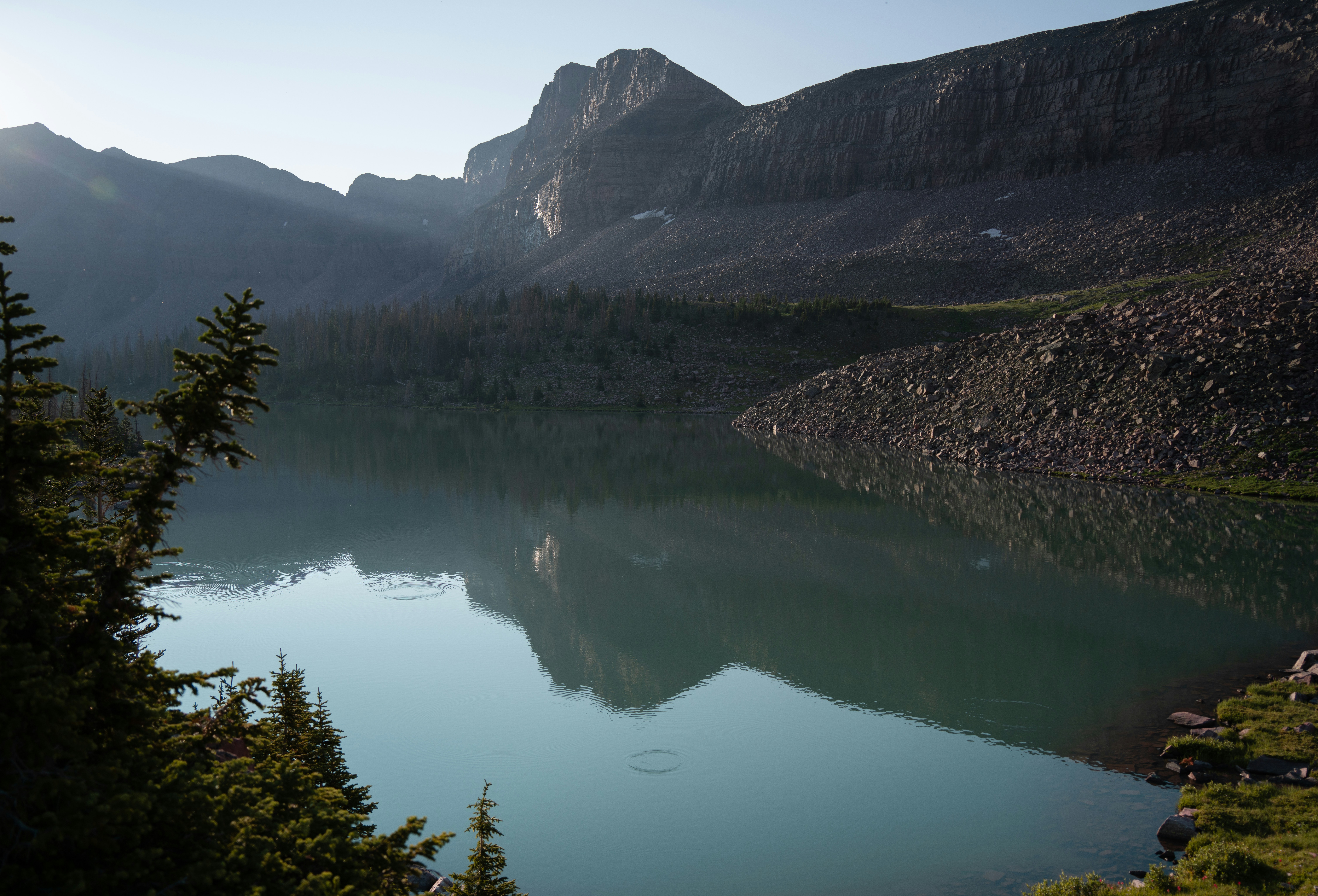 A large body of water surrounded by mountains