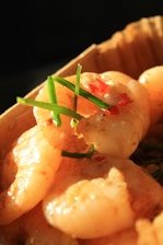 A close up of a plate of food with shrimp
