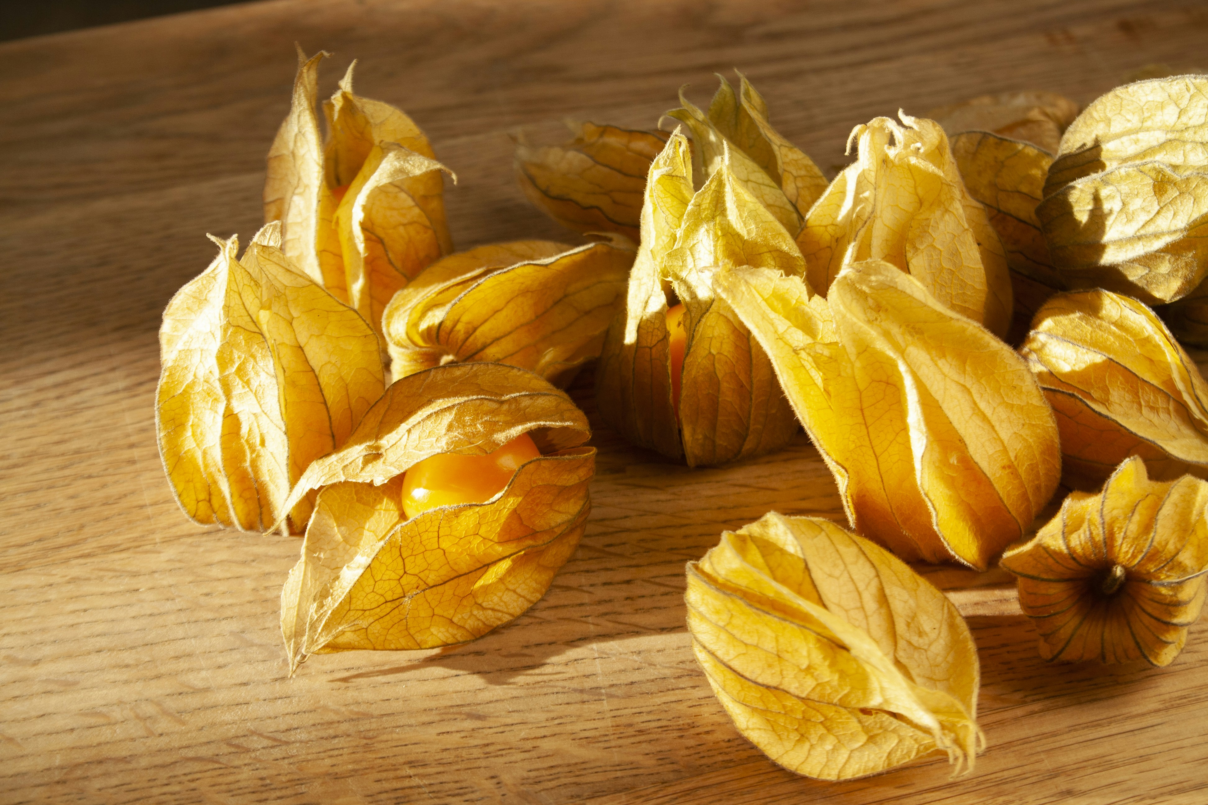 A pile of dried fruit sitting on top of a wooden table
