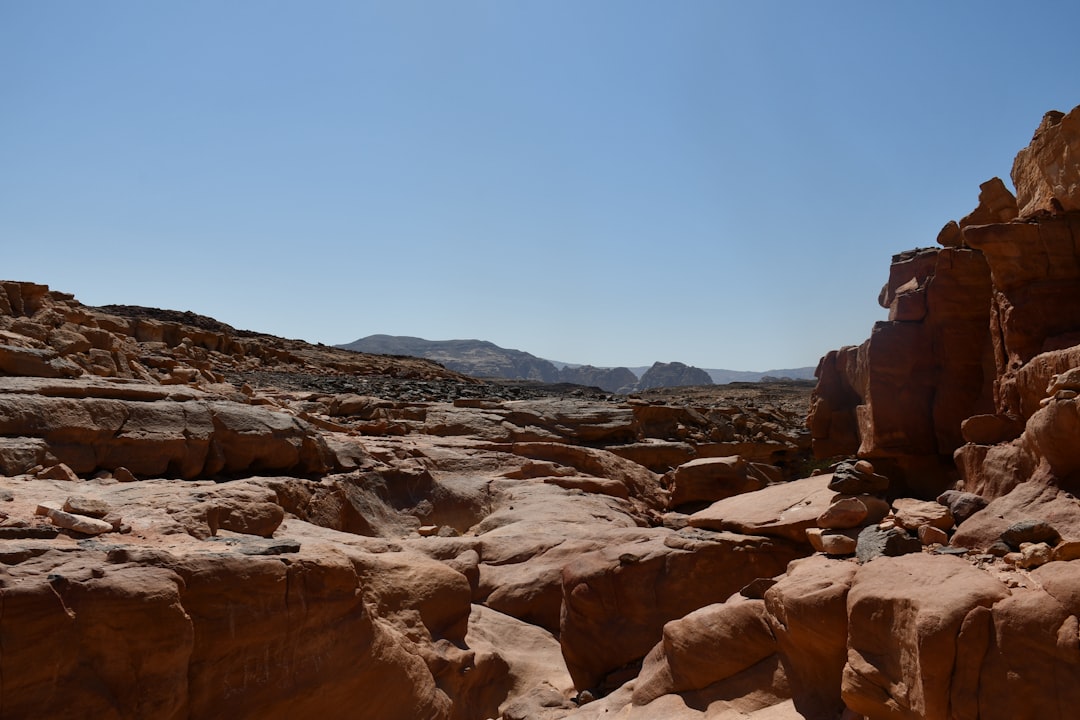 A large rock formation in the middle of a desert,