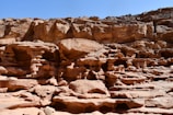 A large rock formation in the middle of a desert