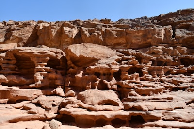 A large rock formation in the middle of a desert