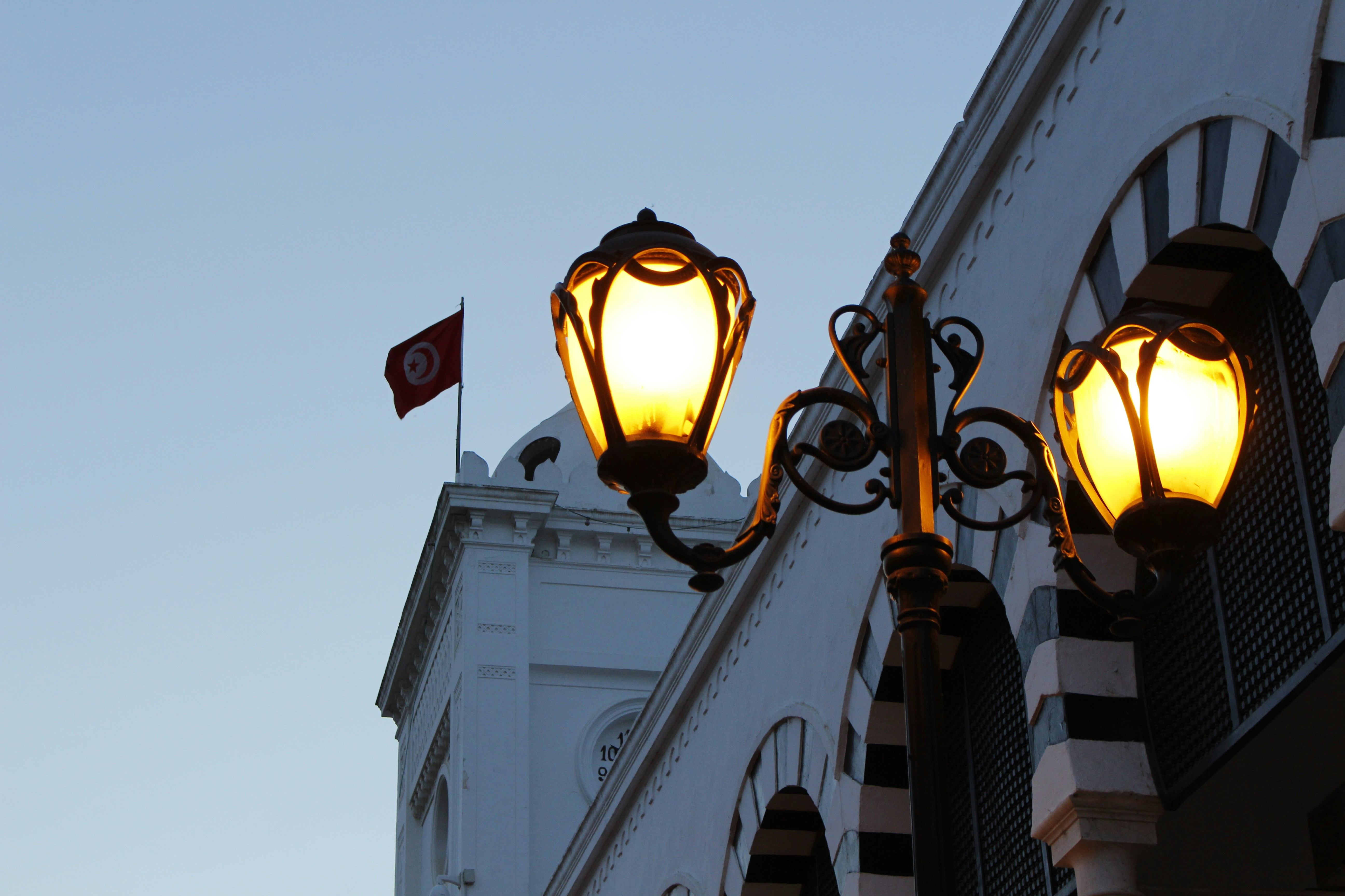 A couple of lights that are on a pole
