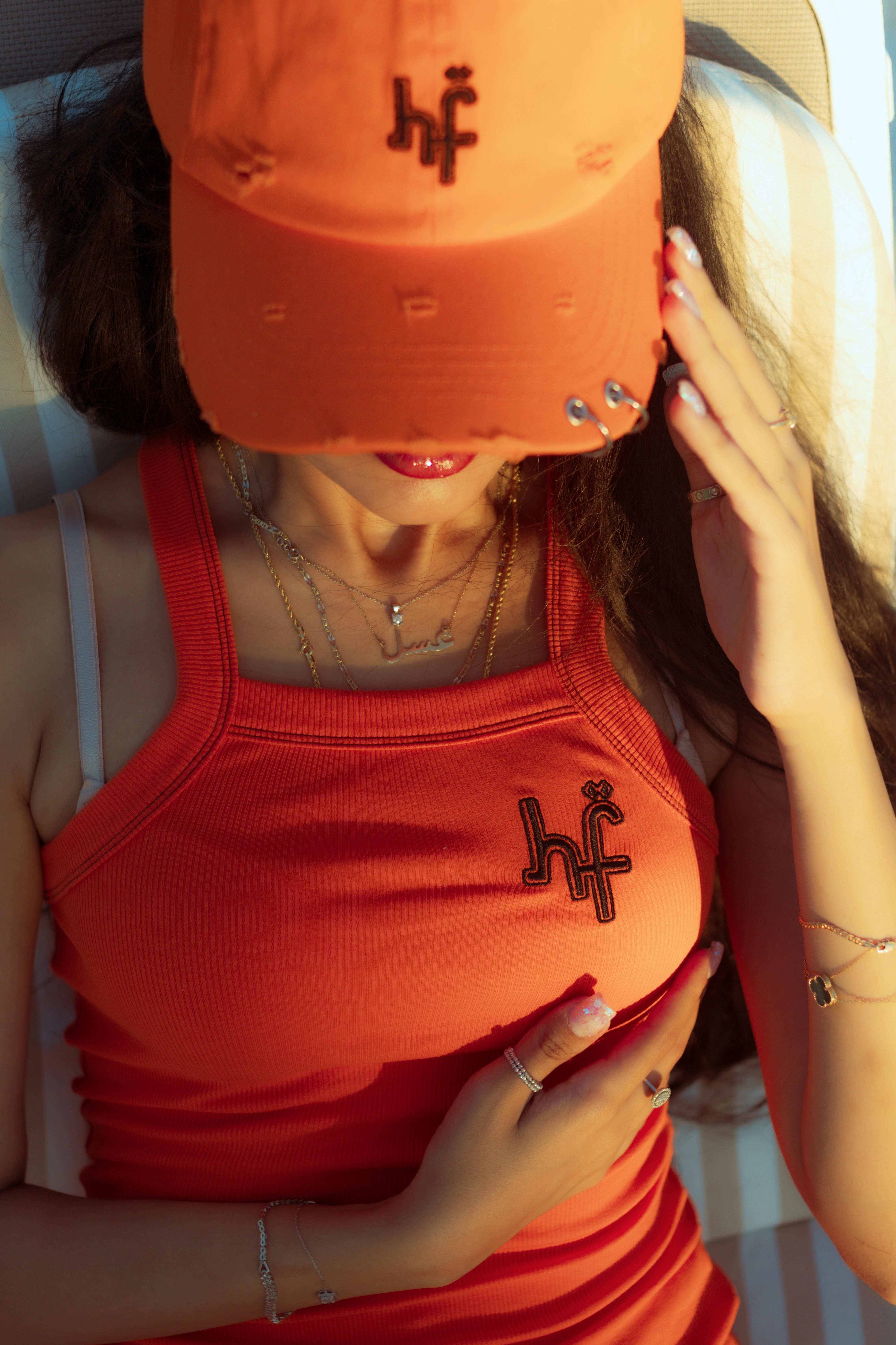 A woman with a hat covering her face