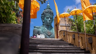 A large statue sitting on top of a set of stairs