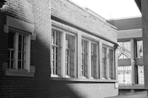 A black and white photo of a brick building