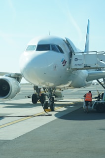 A large jetliner sitting on top of an airport tarmac