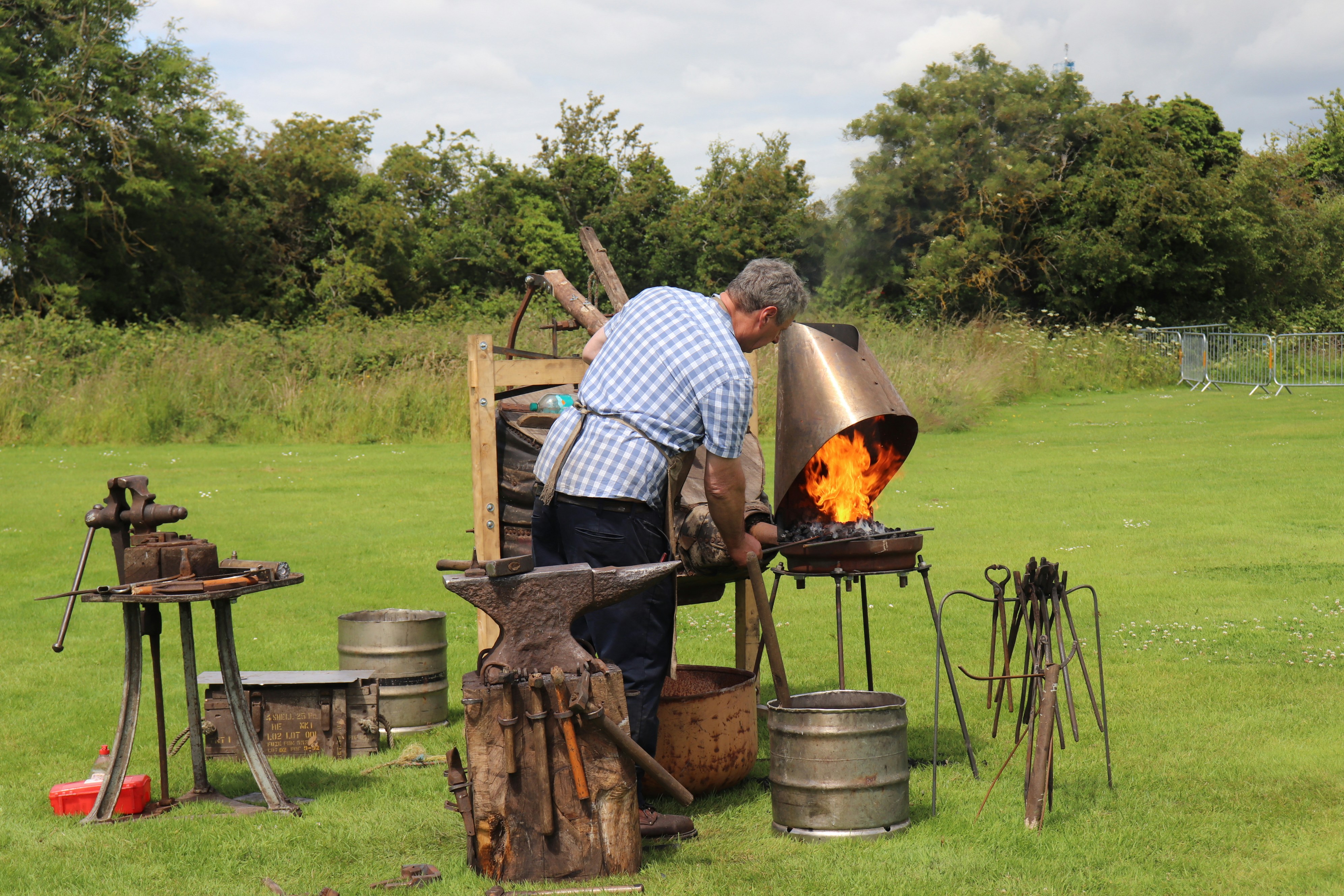 A man working on a fire in a field