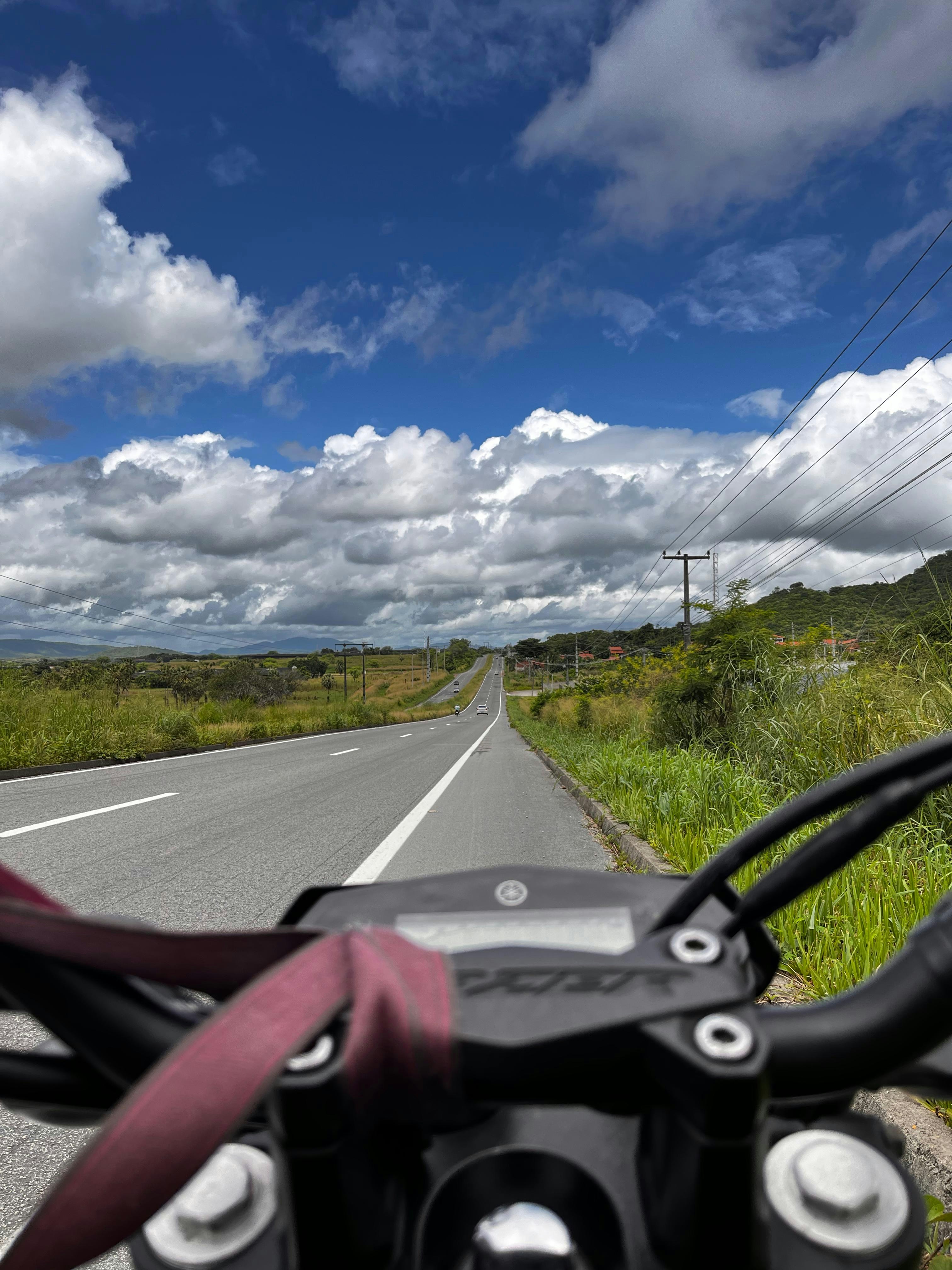 A motorcycle is parked on the side of the road